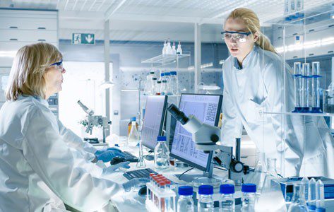 lady looks at her phone searching for clinical trials.