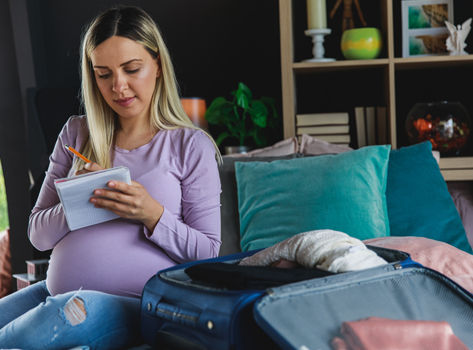 Pregnant woman making a list