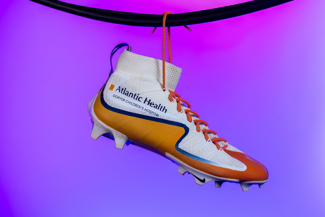 Cleats hanging from the strings.