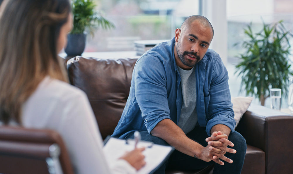 A man talking with a therapist.