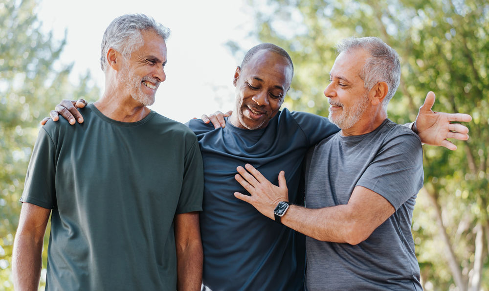 Three older men going on a walk.