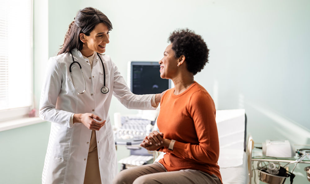 A doctor helping a patient.