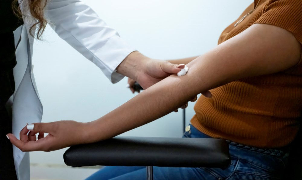 Woman getting blood work.