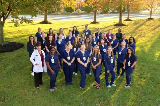 CentraState's RN residency program participants stand outdoors in a group.