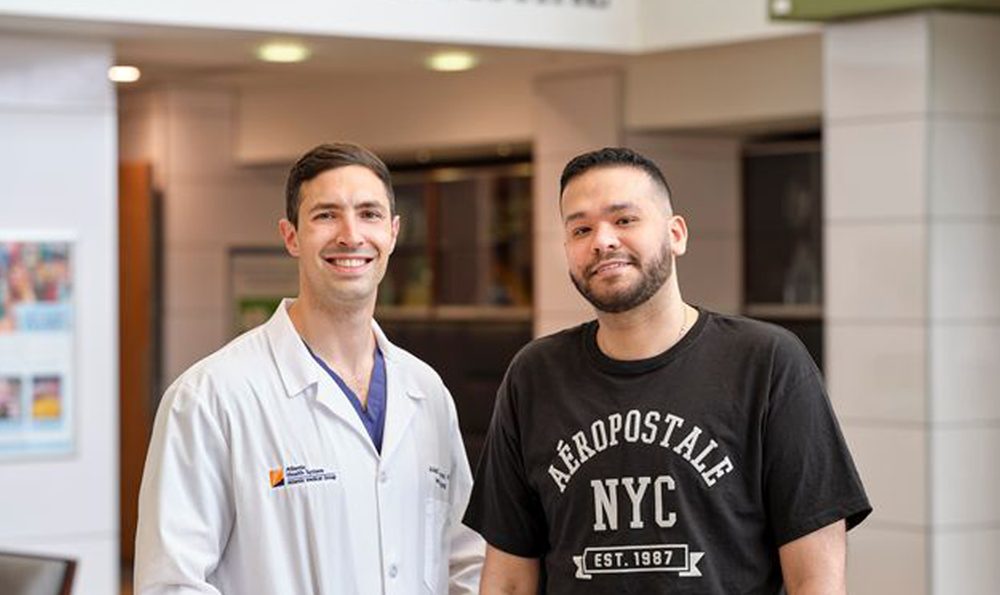 Photo of Deyaden (DD) and Dr. Turturro, who saved his life after a cosmetic procedure gone wrong.