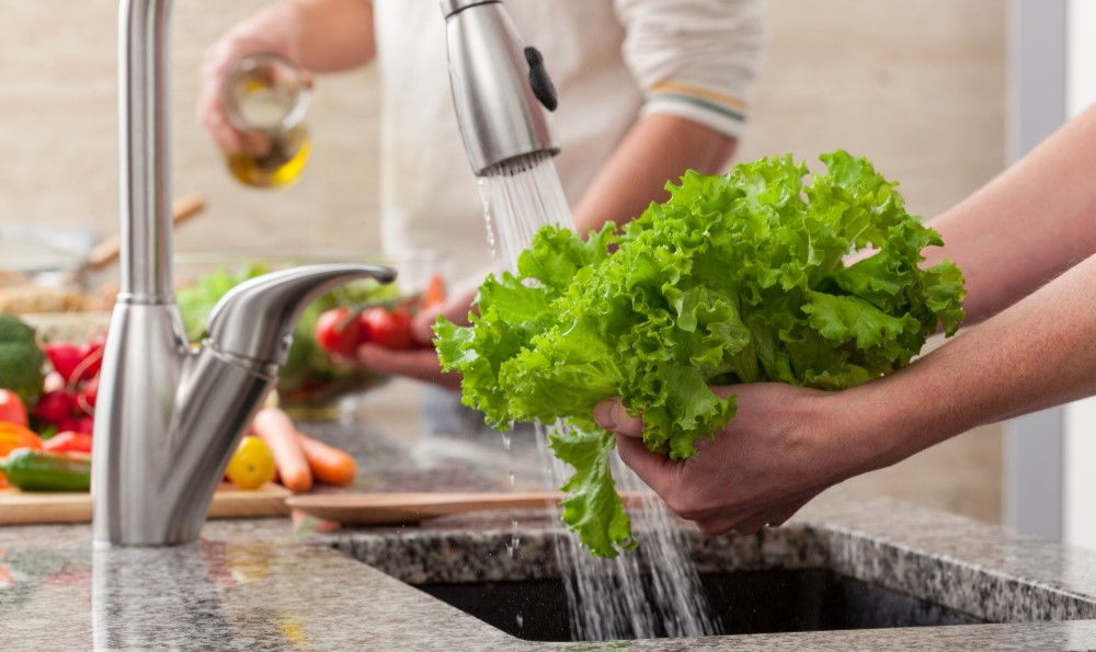 Washing vegetables.