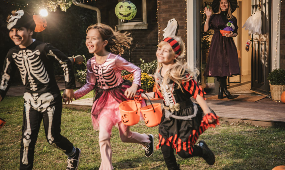 Kids trick or treating on Halloween.