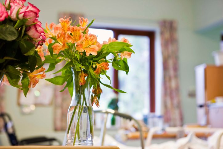 Flowers in a hospital room are shown.