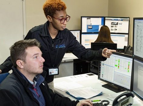 Team members looking at computers.