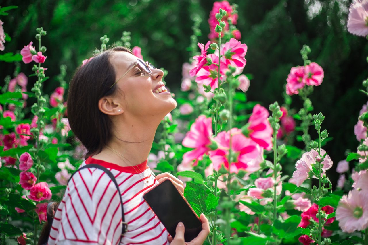 Beautiful girl on the background of spring bush
