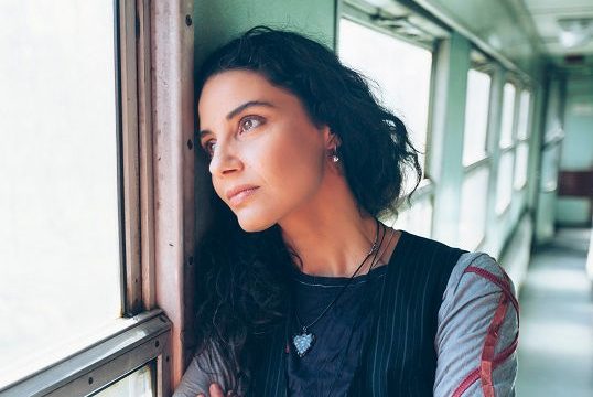 Depressed woman in a train