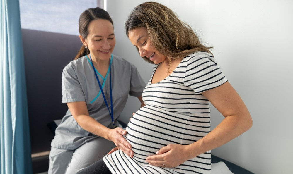 Obstetrician and pregnant woman.