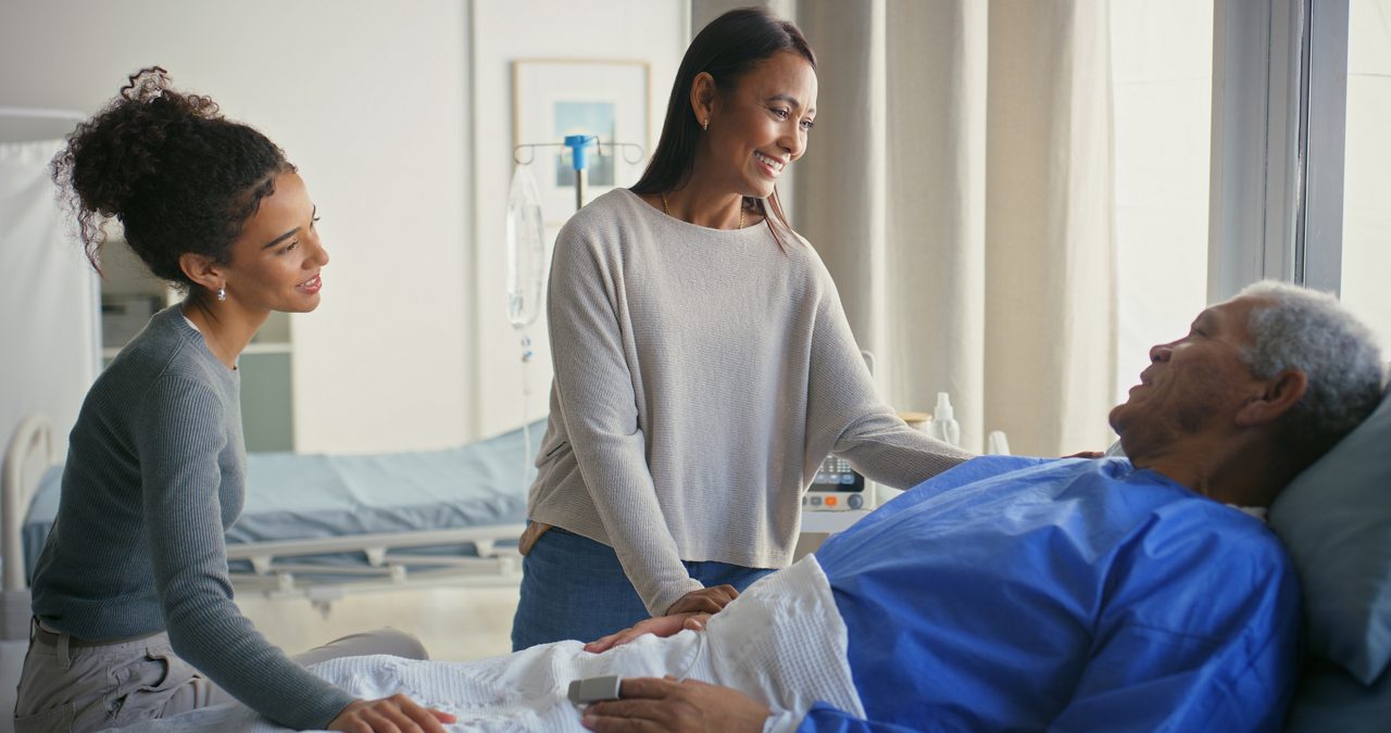Senior man, hospital bed and family with visit and healing patient from surgery and operation at clinic. Retirement, love and daughter with support and care at rehabilitation and healthcare center