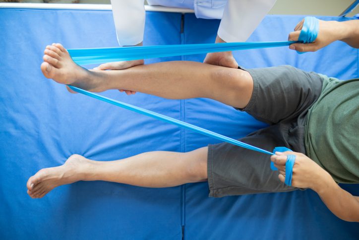 Doctors are examining patient muscle injuries and doing physical therapy for patient to move muscles so they can be used regularly because physical therapy will help strengthen muscles and blood flow.