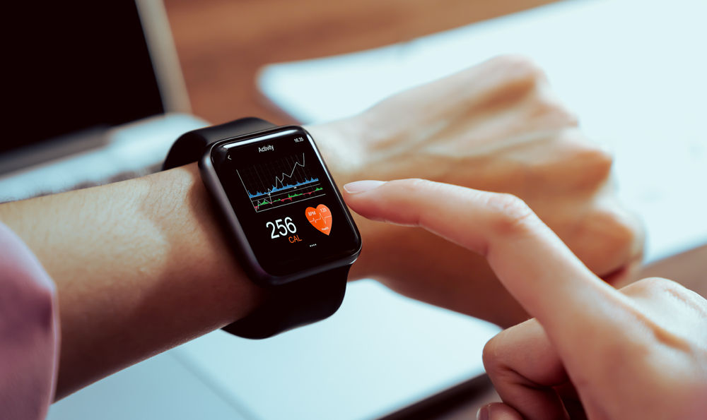 A person checking their smart watch.