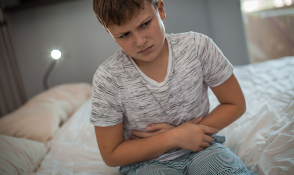 A child holding his stomach