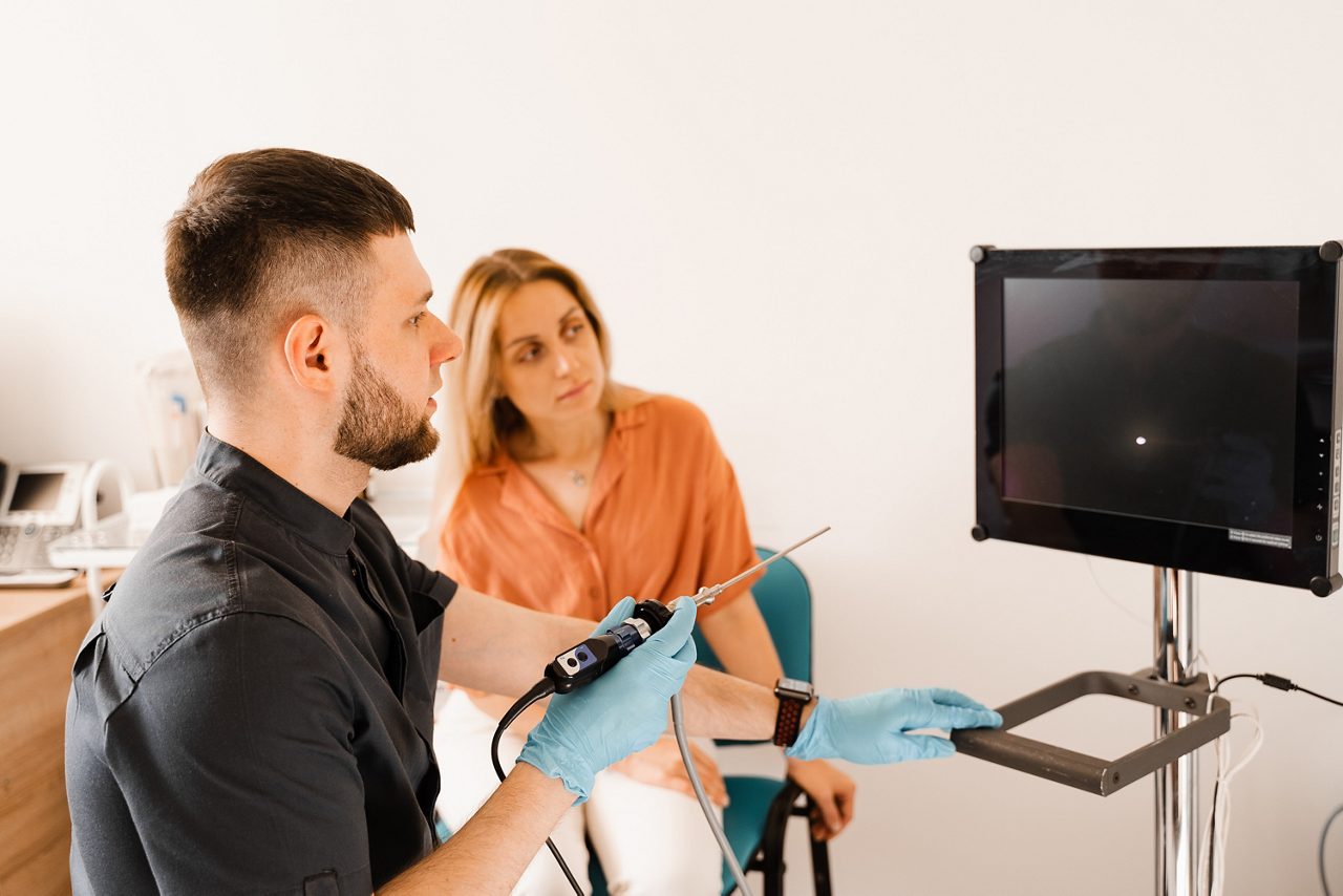 Doctor preforming a video endoscopy.